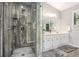 Modern bathroom featuring a glass enclosed shower and dual sink vanity at 8605 Stone Creek Ct, Douglasville, GA 30135