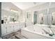 Bathroom boasts a soaking tub and dual sink vanity at 8605 Stone Creek Ct, Douglasville, GA 30135