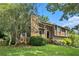 Beautiful split level home with mature trees and a stone chimney at 8605 Stone Creek Ct, Douglasville, GA 30135