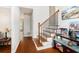 Inviting home foyer with hardwood floors and a staircase at 8605 Stone Creek Ct, Douglasville, GA 30135
