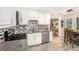 Bright kitchen featuring granite counters, tile backsplash and stainless steel appliances at 8605 Stone Creek Ct, Douglasville, GA 30135