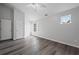 The spacious bedroom has wood floors, natural lighting and a vaulted ceiling at 1510 Paramount Ln, Sugar Hill, GA 30518