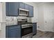 Beautiful kitchen with stainless steel appliances, stylish backsplash, and a modern gas range at 1510 Paramount Ln, Sugar Hill, GA 30518