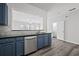 Stylish kitchen featuring stainless steel appliances, granite countertops, and hardwood floors at 1510 Paramount Ln, Sugar Hill, GA 30518
