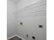 The laundry room has a wire rack shelf and utility hook-ups at 1510 Paramount Ln, Sugar Hill, GA 30518