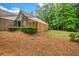 Side view of fenced yard and exterior of home with brick, siding and lush green landscaping at 3221 Abbott Dr # 5, Powder Springs, GA 30127