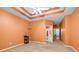 Carpeted bedroom with a tray ceiling, and an open door to the Primary bath and dressing area at 3221 Abbott Dr # 5, Powder Springs, GA 30127