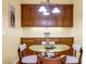 Cozy dining area featuring a glass table and natural wood cabinets at 3221 Abbott Dr # 5, Powder Springs, GA 30127