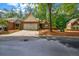 Charming brick home featuring a well-manicured lawn and a two-car garage at 3221 Abbott Dr # 5, Powder Springs, GA 30127