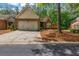 Charming brick home featuring a well-manicured lawn and a two-car garage at 3221 Abbott Dr # 5, Powder Springs, GA 30127