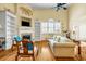 Bright living room featuring hardwood floors, a fireplace, and large bright windows at 3221 Abbott Dr # 5, Powder Springs, GA 30127