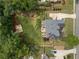 Aerial view of a landscaped backyard with mature trees surrounding the property at 412 Mill Stream Way, Woodstock, GA 30188