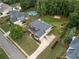 An aerial view of the house shows a spacious backyard, pool, and basketball court at 412 Mill Stream Way, Woodstock, GA 30188
