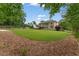 A large, well-manicured backyard with patio is perfect for outdoor enjoyment at 412 Mill Stream Way, Woodstock, GA 30188