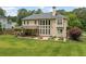 The backyard has a covered patio, fire pit, and lush green space at 412 Mill Stream Way, Woodstock, GA 30188