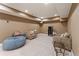 Spacious finished basement with carpet, seating, and a TV at 412 Mill Stream Way, Woodstock, GA 30188