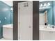 Bathroom with dual sinks, white cabinets, and a modern design at 412 Mill Stream Way, Woodstock, GA 30188