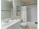 Bathroom featuring a large vanity sink, toilet, and bathtub with a shower at 412 Mill Stream Way, Woodstock, GA 30188