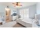 Light and airy bedroom featuring neutral decor, a ceiling fan, and en suite bathroom at 412 Mill Stream Way, Woodstock, GA 30188