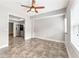 The dining room offers tile flooring and a ceiling fan at 412 Mill Stream Way, Woodstock, GA 30188