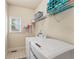 Functional laundry room with modern appliances and ample storage space, perfect for everyday convenience at 412 Mill Stream Way, Woodstock, GA 30188
