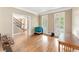 Inviting dining area with gleaming hardwood floors, lots of natural light, and views of the staircase at 412 Mill Stream Way, Woodstock, GA 30188