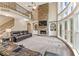 Two story living room with a stunning stone fireplace and expansive windows at 412 Mill Stream Way, Woodstock, GA 30188