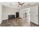 Spacious living room includes a ceiling fan and access to the kitchen at 412 Mill Stream Way, Woodstock, GA 30188