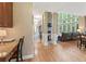 Open concept living space with stone fireplace and wall of windows at 412 Mill Stream Way, Woodstock, GA 30188