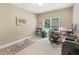 Comfortable home office bathed in light from the windows with views of outside, complete with computer and office accessories at 412 Mill Stream Way, Woodstock, GA 30188