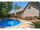 Expansive backyard features a pool, multi-level deck, and stairs, perfect for outdoor entertaining and relaxation at 5602 Asheforde Ln, Marietta, GA 30068