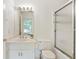 Well-lit bathroom features a walk-in shower with glass doors and a neutral, modern vanity at 5602 Asheforde Ln, Marietta, GA 30068