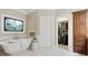 Luxurious bathroom with freestanding tub, stained glass window, and walk-in closet access at 5602 Asheforde Ln, Marietta, GA 30068
