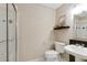 Bathroom with a modern sink, toilet, and shower with glass doors at 5602 Asheforde Ln, Marietta, GA 30068
