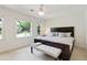 Nicely appointed bedroom features large windows, neutral walls and carpet, and a bench seat at 5602 Asheforde Ln, Marietta, GA 30068