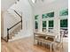 Bright dining area featuring hardwood floors, tall windows, and deck access at 5602 Asheforde Ln, Marietta, GA 30068