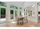 Bright dining area with hardwood floors and lots of windows overlooking the backyard at 5602 Asheforde Ln, Marietta, GA 30068