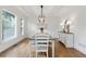 Dining room featuring hardwood floors, white trim and an abundance of natural light at 5602 Asheforde Ln, Marietta, GA 30068