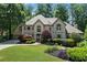Stunning two-story home boasts professionally landscaped yard and a circular driveway at 5602 Asheforde Ln, Marietta, GA 30068