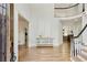 Bright foyer with wood floors, a curved staircase, and white trim at 5602 Asheforde Ln, Marietta, GA 30068