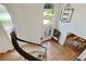 Aerial view of the home's grand foyer with a staircase, dining room and modern light fixture at 5602 Asheforde Ln, Marietta, GA 30068