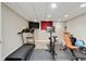 Home gym featuring modern exercise equipment and a flat screen television at 5602 Asheforde Ln, Marietta, GA 30068