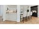 Well-designed kitchen features bar stool seating, white cabinets, granite countertops and stainless appliances at 5602 Asheforde Ln, Marietta, GA 30068