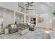 Open concept living room with high ceilings and plenty of natural light, seamlessly connected to the kitchen at 5602 Asheforde Ln, Marietta, GA 30068