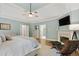 Large primary bedroom with tray ceiling, fireplace, and sitting area at 5602 Asheforde Ln, Marietta, GA 30068