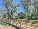 Scenic wooden walkway bridge surrounded by trees, creating a tranquil outdoor experience at 5602 Asheforde Ln, Marietta, GA 30068