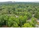 Aerial shot showcasing the property's location nestled among mature trees, providing privacy and natural beauty at 766 Lost Creek Cir, Stone Mountain, GA 30088