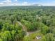 An aerial view of the neighborhood, showing a peaceful community surrounded by mature trees at 766 Lost Creek Cir, Stone Mountain, GA 30088