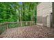 Back deck featuring wooded scenery, and natural wood finishings at 766 Lost Creek Cir, Stone Mountain, GA 30088