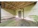 Back patio with coverage, accessible utility access, and natural color palettes at 766 Lost Creek Cir, Stone Mountain, GA 30088